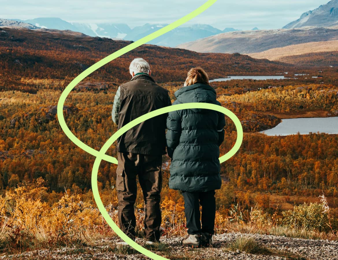 An older couple standing together in nature